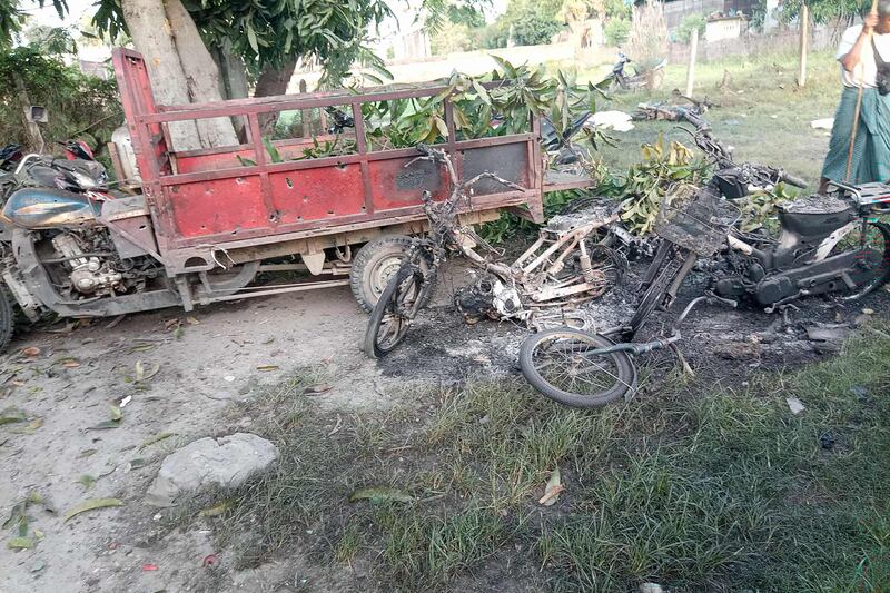 This image courtesy of Yebaw Hlyat Cee taken on October 7, 2025 shows damage to vehicles next to the site of a military strike in central Myanmar's Chaung U township.