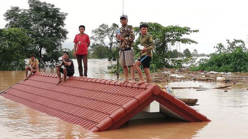 Lao villagers in Attapeu province's Sanamxay district wait for rescue following collapse of a dam, July 24, 2018.