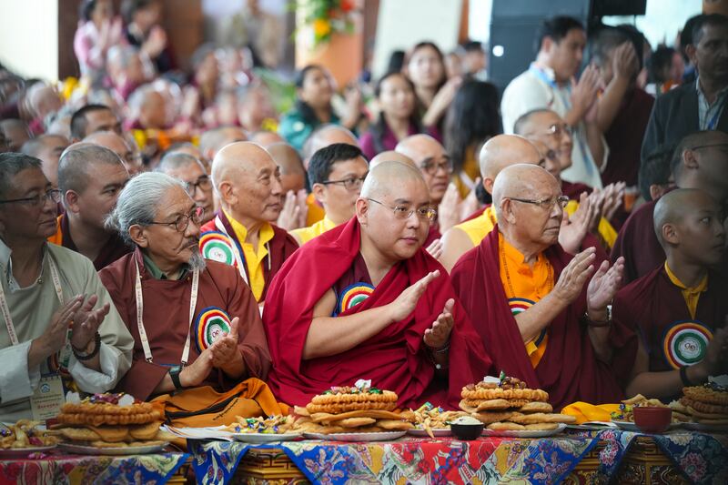 A child is lifted higher to see the stage during celebrations on the 90th birthday of the Dalai Lama at the Main Temple in Dharamsala, India, July 6, 2025.
