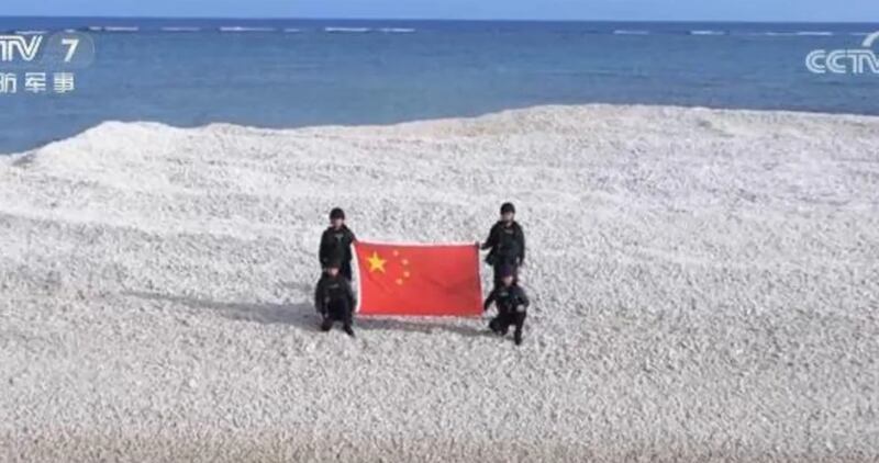 Chinese state media released a photo of coast guard officers on the disputed reef.