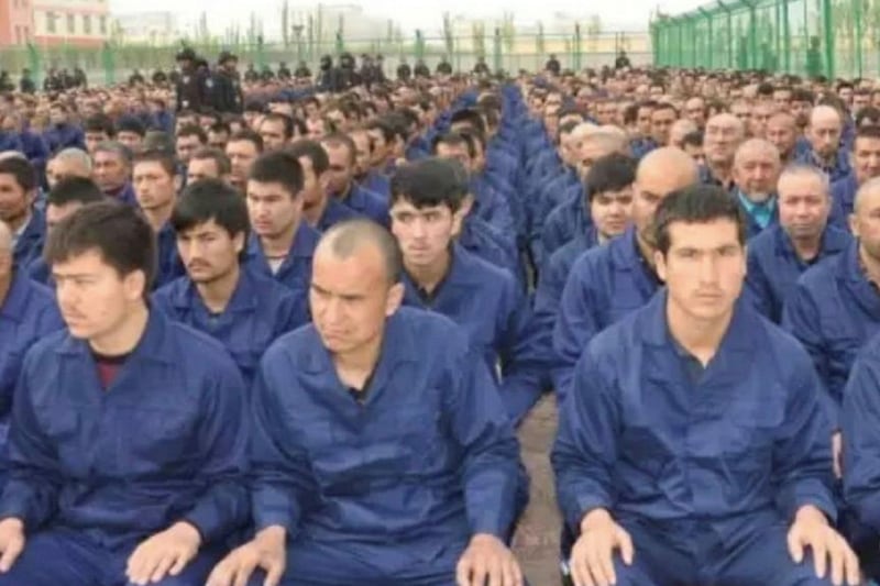 A photo posted to the WeChat account of the Xinjiang Judicial Administration shows Uyghur detainees listening to a “de-radicalization” speech at a re-education camp in Hotan prefecture’s Lop county, April 2017.