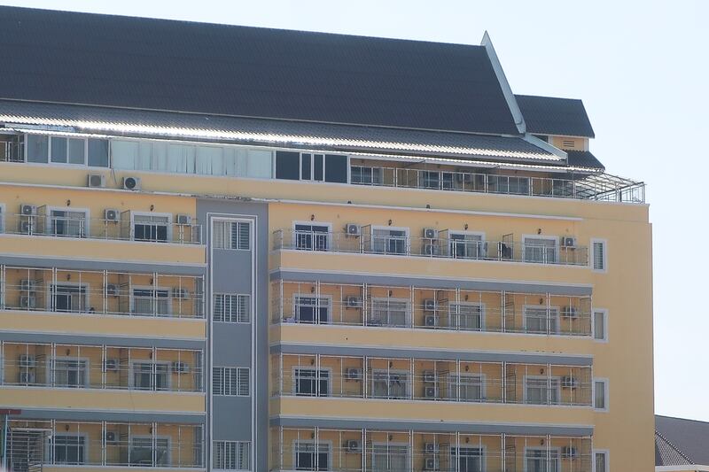 This image released by Amnesty International on June 26, 2025, as part of a report on scam centers in Cambodia shows “caged windows behind high walls of a scamming compound with three rungs of barbed or razor wire.”